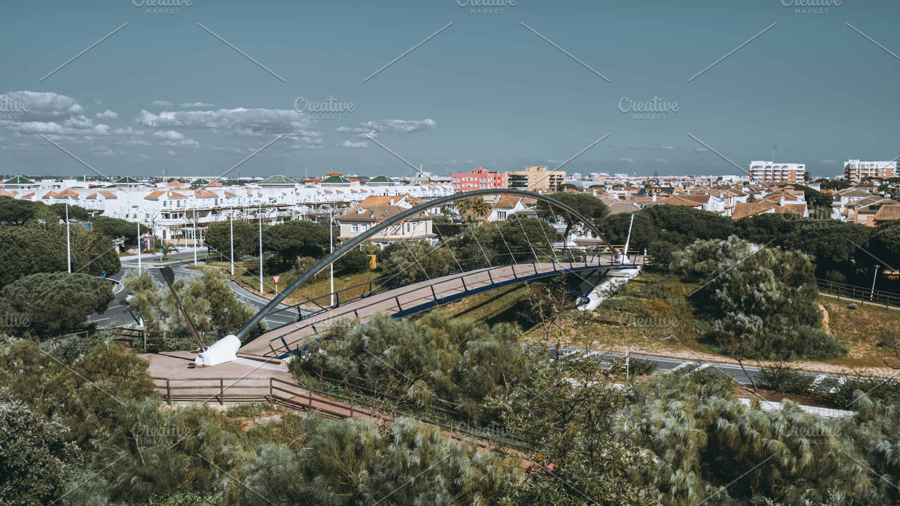 Urban bridge in sunny Spanish town, an Architecture Photo by SkyNext