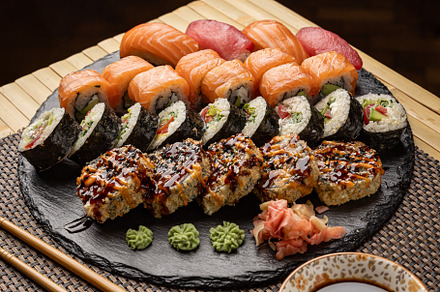 Sushi set served on black slate