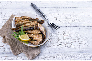 Canned smoked sprats in oil, a Food & Drink Photo by Yulia Furman