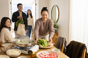 Hot pot party with cheerful friends, a Photo by Dvoevnore photos