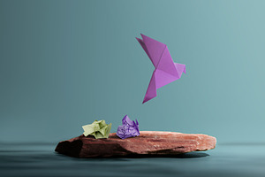 Origami bird emerging from paper symbolizing creativity, imagina, a Photo by salmon.black