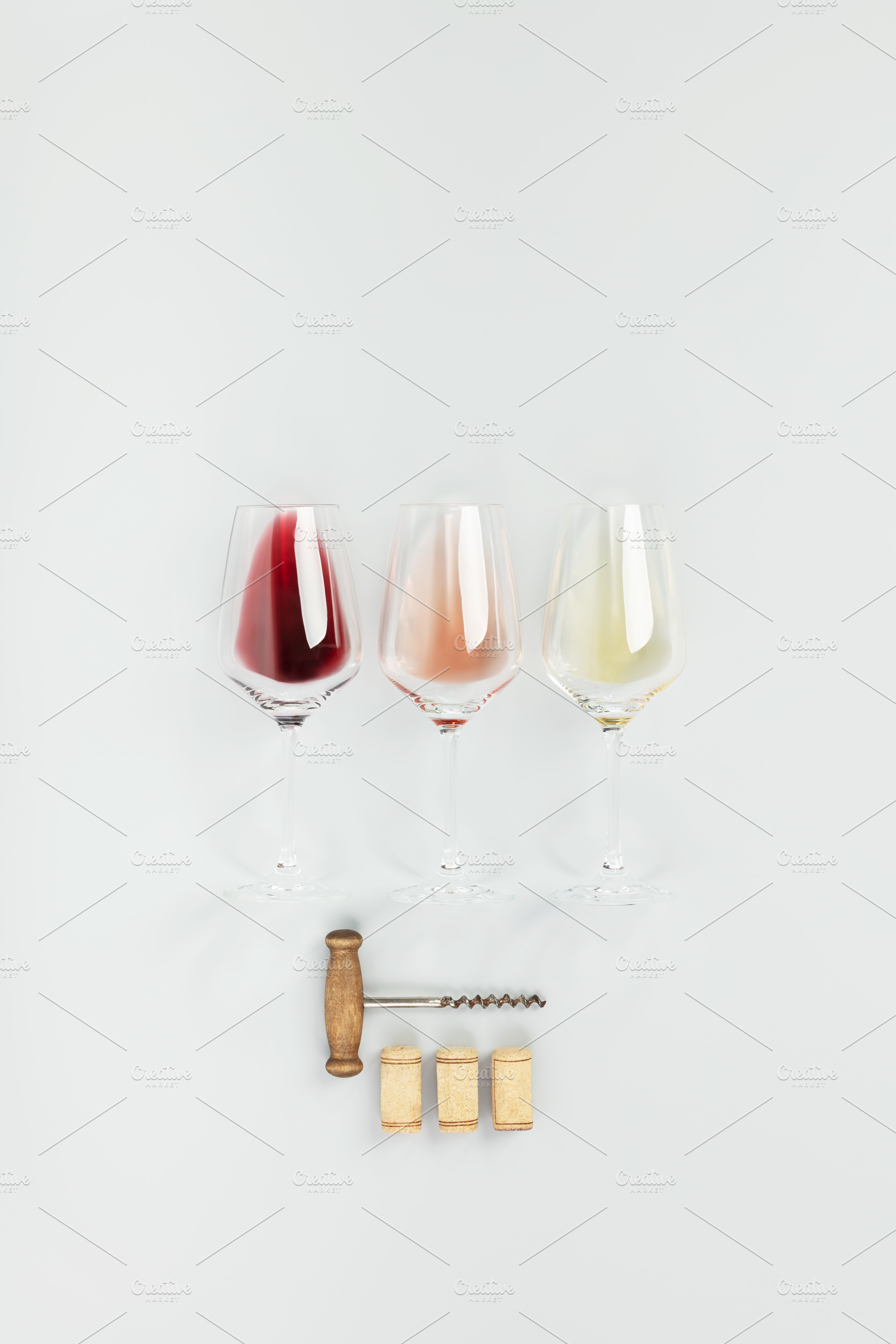 Flat-lay of red, rose and white wine in glasses on white background, a Food & Drink Photo by Natalia Klenova's Shop
