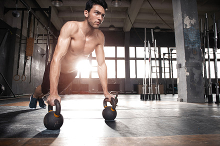muscular man doing a pushups at gym, a Sports & Recreation Photo by OPOLJA