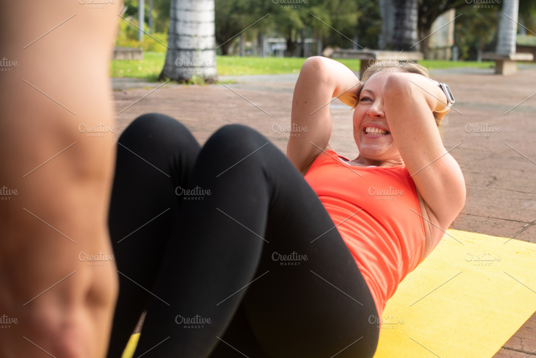 Mature Woman Doing Abs Workout on Yoga Mat Outdoors, a Person Photo by etorres69