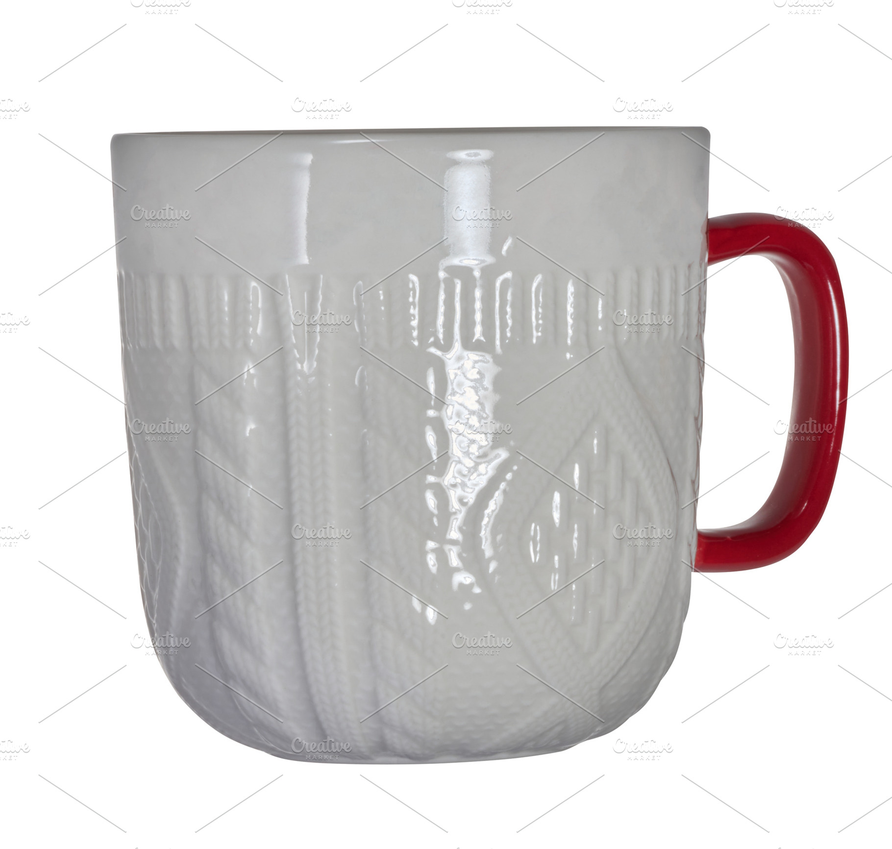 White ceramic mug with knitted relief and red handle on isolated, a Beauty & Fashion Photo by ndanko