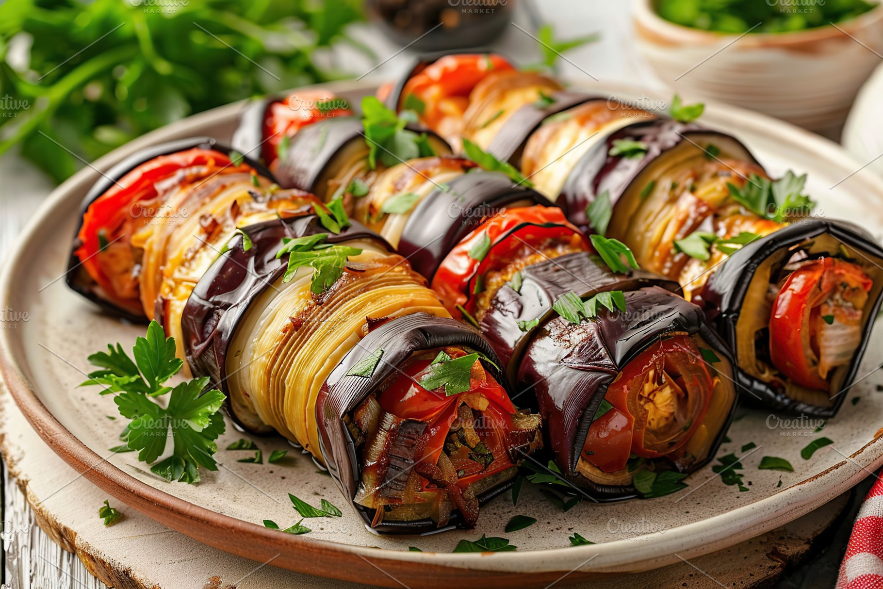 Rolled up eggplant stuffed with cheese and tomatoes in plate, a Food & Drink Photo by AlyaAnd