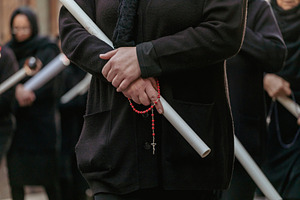 Woman Holding Candle and Rosary During Good Friday Procession in Italy, a Holiday Photo by Antonio Gravante Market