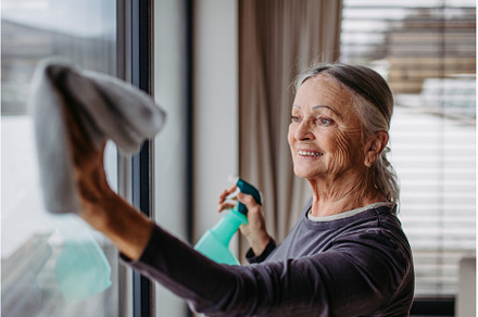 Senior woman cleaning windows in the, a Person Photo by HalfPoint