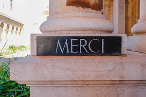 sign with the word merci at Lerins Abbey, France, a Photo by Nito