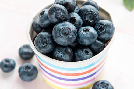 Blueberries on tile background, a Food & Drink Photo by Olena Rudo