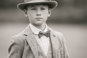 Young boy dressed in vintage tweed suit and fedora hat, portrayi, a Person Photo by Studio ANNA