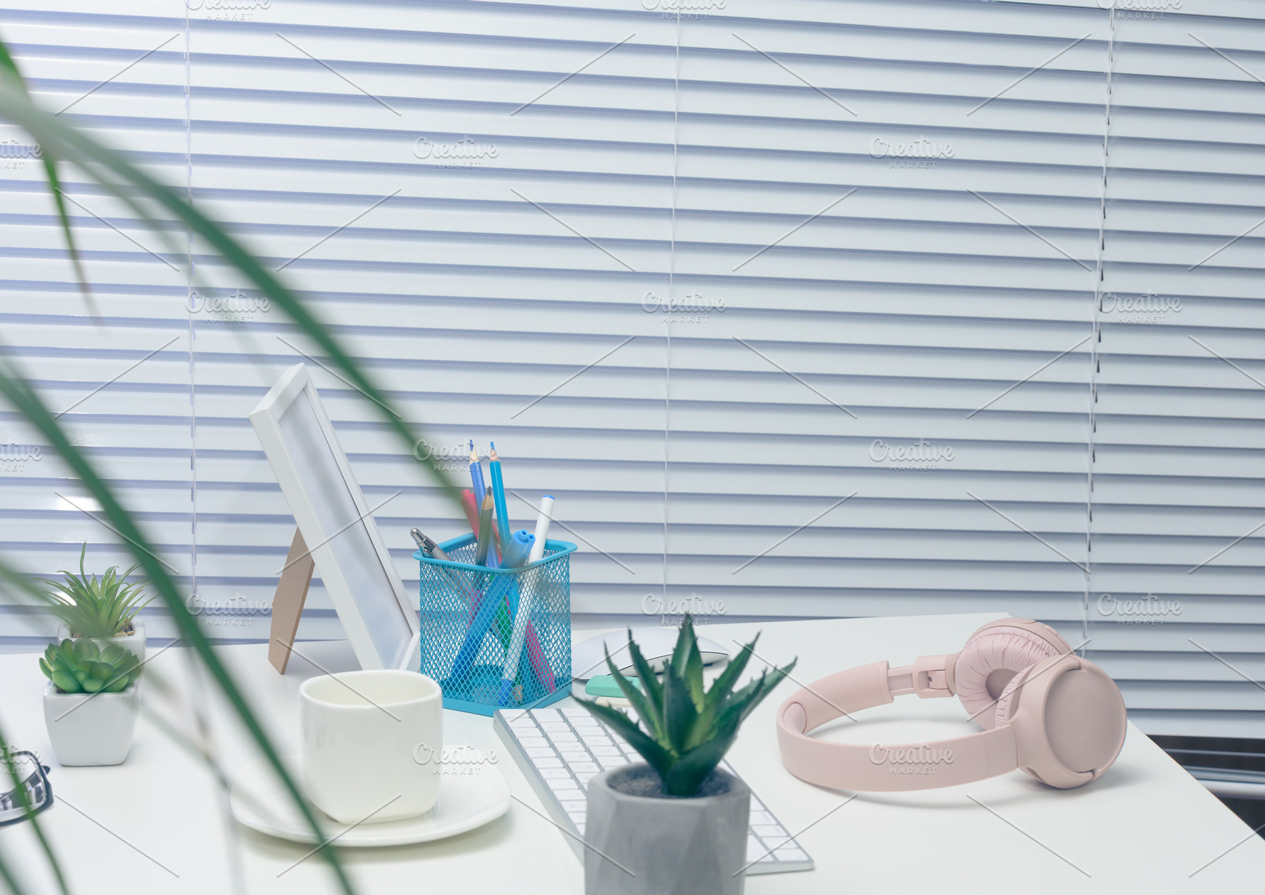 Desk with white keyboard, pink headphones, potted cacti, photo f, a Technology Photo by ndanko
