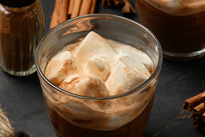 Hot chocolate with fluffy marshmallows on a wooden board., a Food & Drink Photo by ndanko