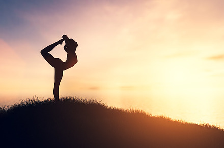 Woman in yoga pose at sunset., a Health & Medical Photo by Photocreo Michal Bednarek