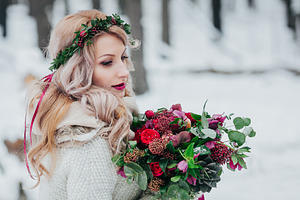 A young girl of slavic appearance with a wreath of wildflowers beautiful