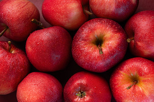 Fresh red apples forming appealing composition on dark backgroun, a Food & Drink Photo by Olena Rudo