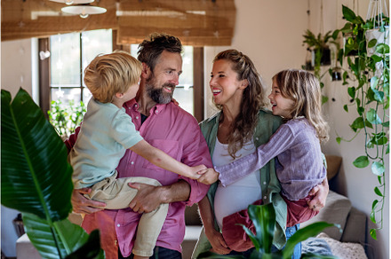Portrait of young family at home, a Person Photo by HalfPoint