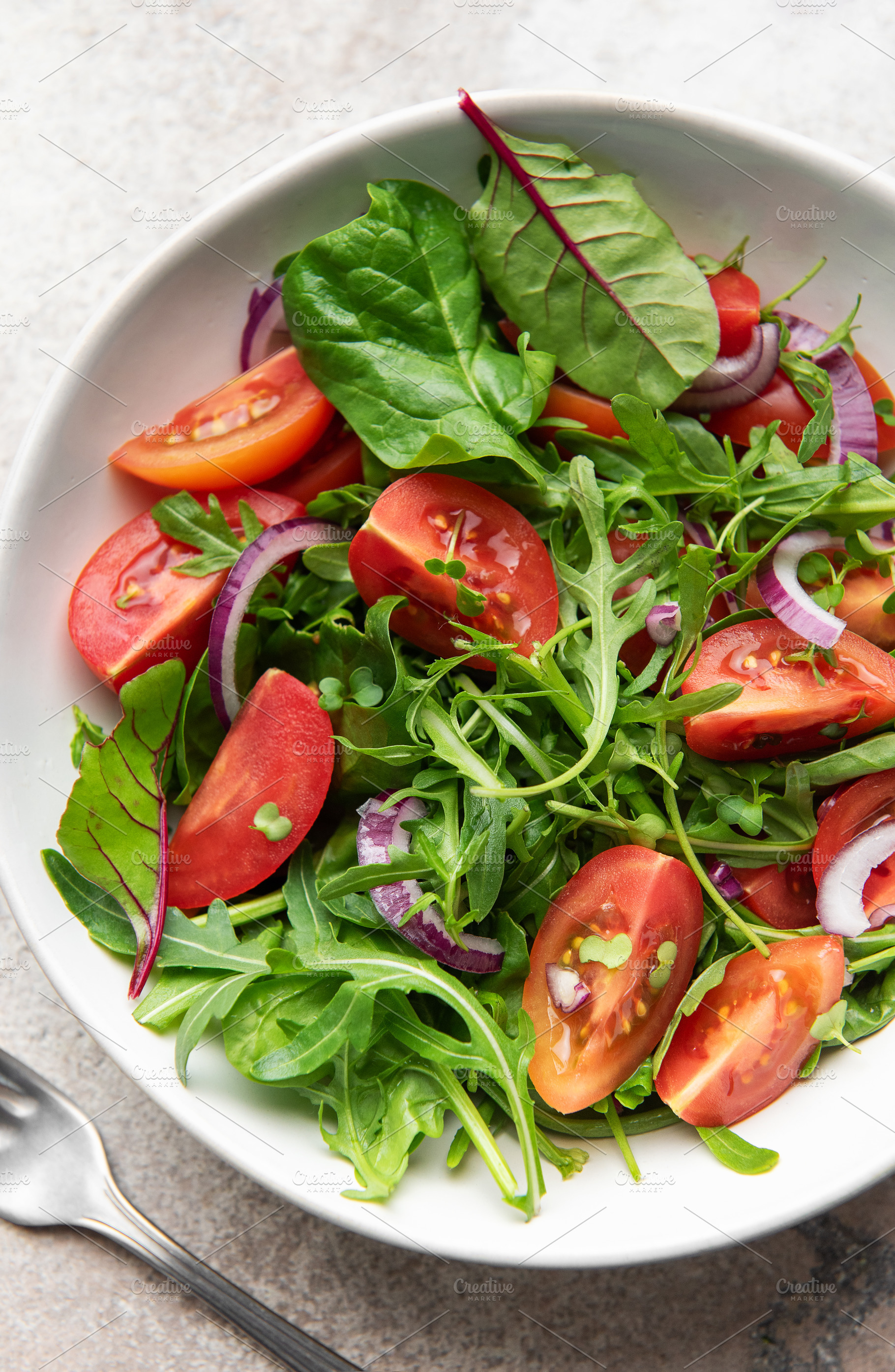 Healthy fresh garden salad with cherry tomatoes, a Food & Drink Photo by Olena Rudo