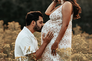 Couple expecting a baby in a flower, a Person Photo by Perpis