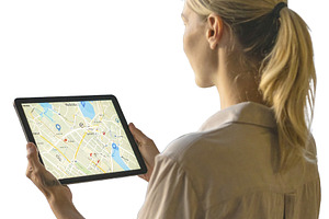 Traveler holding a tablet with map isolated photo, a Technology Photo by DanFLCreativo