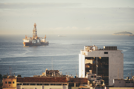 Dawn lights up Rio's offshore rig, an Industrial Photo by SkyNext