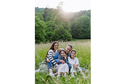 Beautfiul young family sitting in, a Nature Photo by HalfPoint