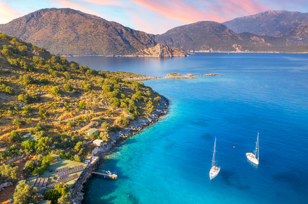 Aerial view of beautiful yachts and boats on the sea at sunset, a Nature Photo by den-belitsky