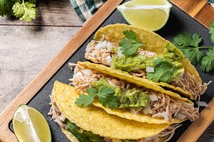 Mexican chicken tacos with guacamole and cilantro