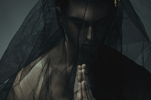 Man in black cloth and a gold crown containing imposing, caucasian, and