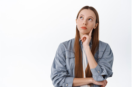Pensive young woman with long hair, a Beauty & Fashion Photo by Cookie Studio