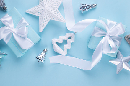 Christmas blue background. Holidays gift box wrapped in blue pap, a Holiday Photo by vimart