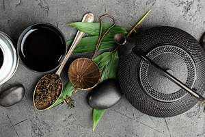 Asian Tea Ceremony Banner with Natural Ingredients on Dark Stone