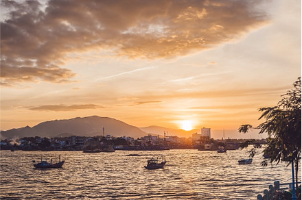 Sunset in Vietnam, sea, small houses, a Nature Photo by Elizaveta Galitskaya