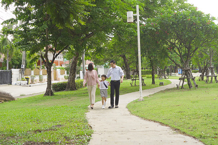 Portrait of happy smiling Asian Family walking together in publi, a Photo by Tampatra