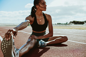 Athlete doing stretching exercises, a Person Photo by Jacob Lund