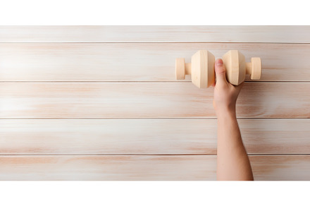 Hand grip dumbbell on a light wooden, a Sports & Recreation Photo by ZinetroN