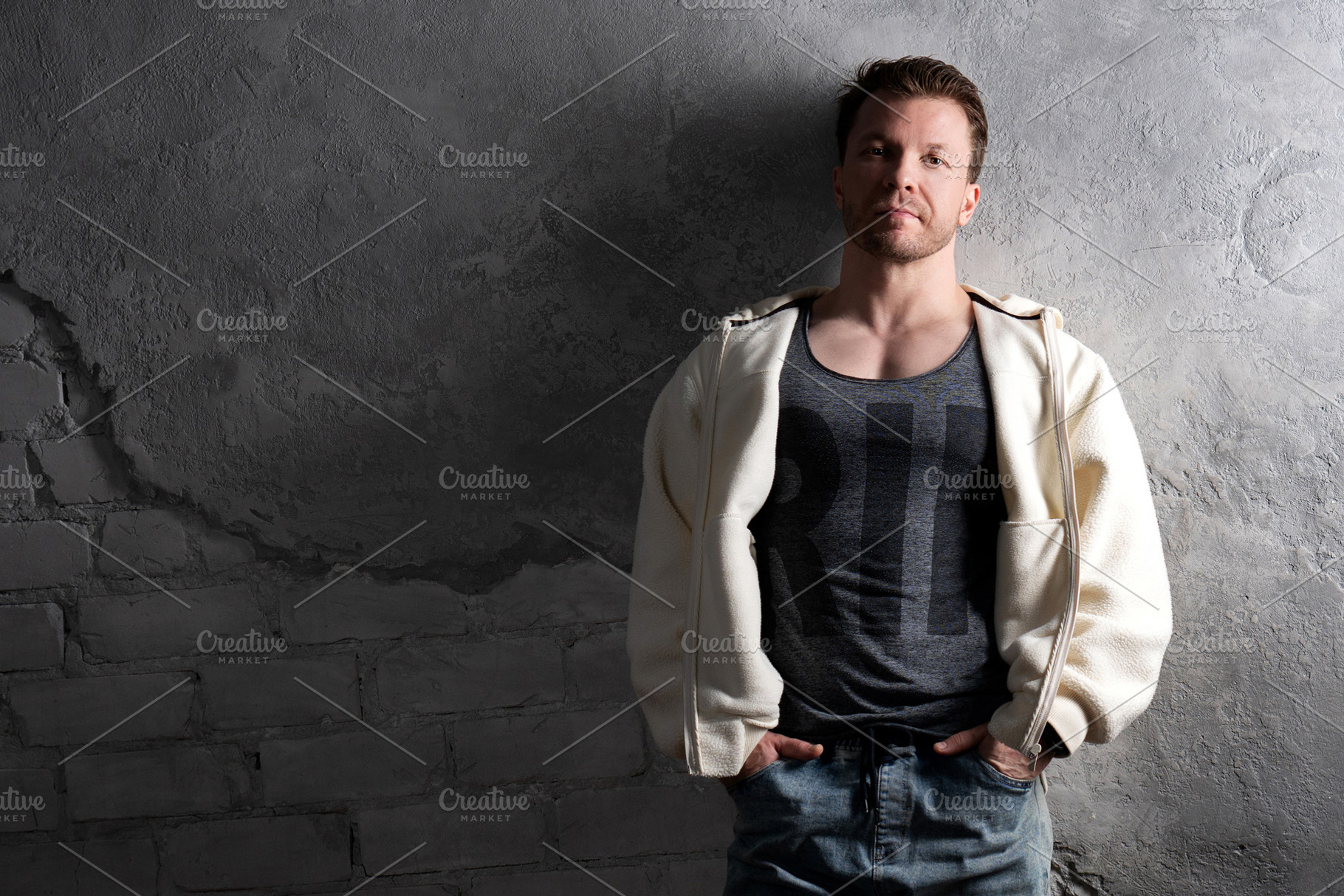 Man in fleece hoodie and jeans, a Person Photo by Elena Vagengeim