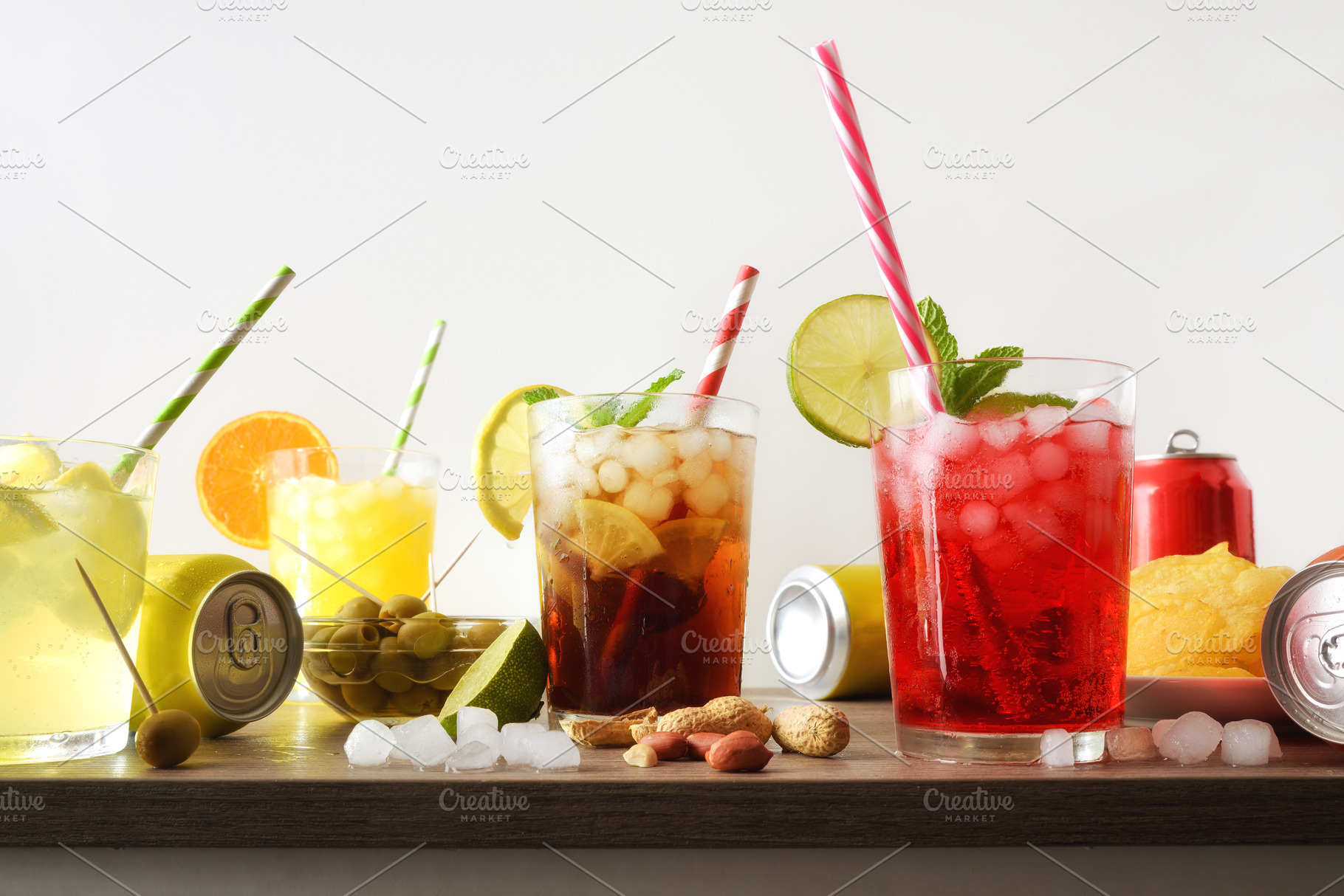 Several glasses with soft drinks of different flavors isolated b, a Food & Drink Photo by Davizro's Market