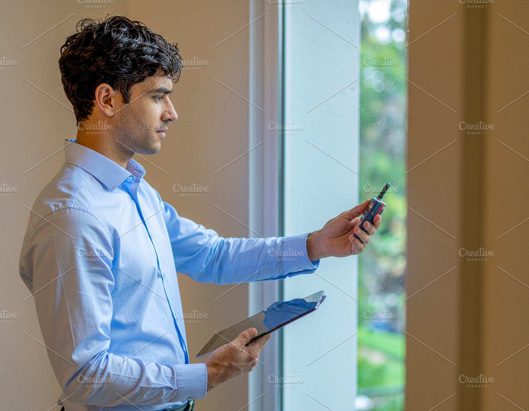 Home inspection audit by professional near window, a Photo by DanFLCreativo