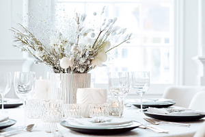 Elegant winter dinner party table setting with sparkling floral, a Photo by Studio ANNA