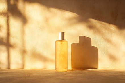 Bottled essence on a warm surface, a Photo by Beautiful things
