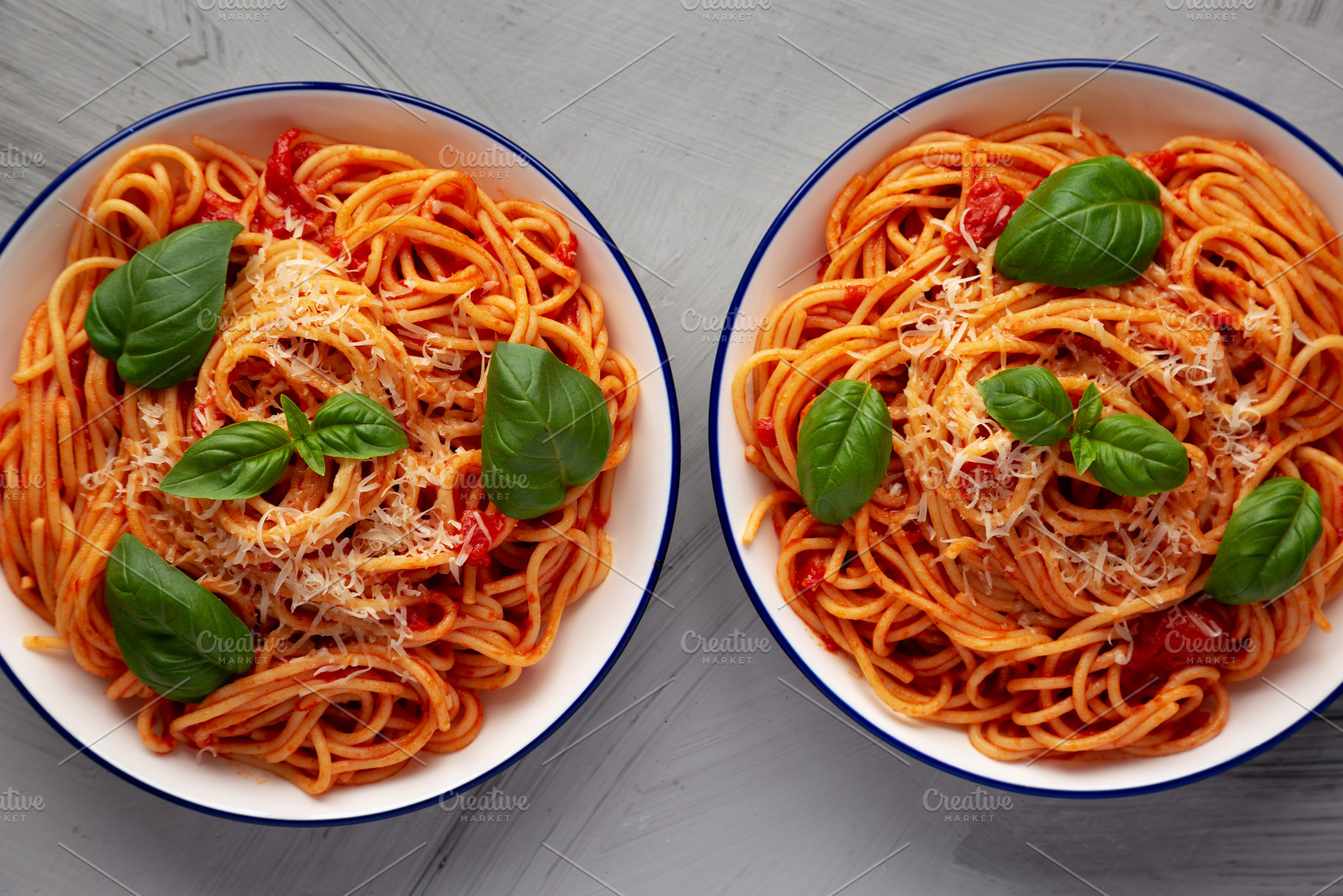 Homemade Pasta Pomodoro on Plates, top view. Flat lay, overhead,, a Food & Drink Photo by LiudmylaChuhunova