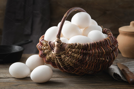 Wicker basket full of chicken eggs.