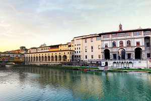 Uffizi Gallery and Ponte Vecchio reflecting on Arno River at sunset in Florence, an Architecture Photo by Antonio Gravante Market