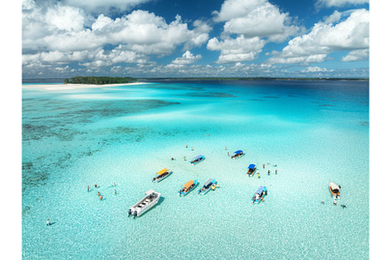 Aerial view of boats in clear azure, a Nature Photo by den-belitsky