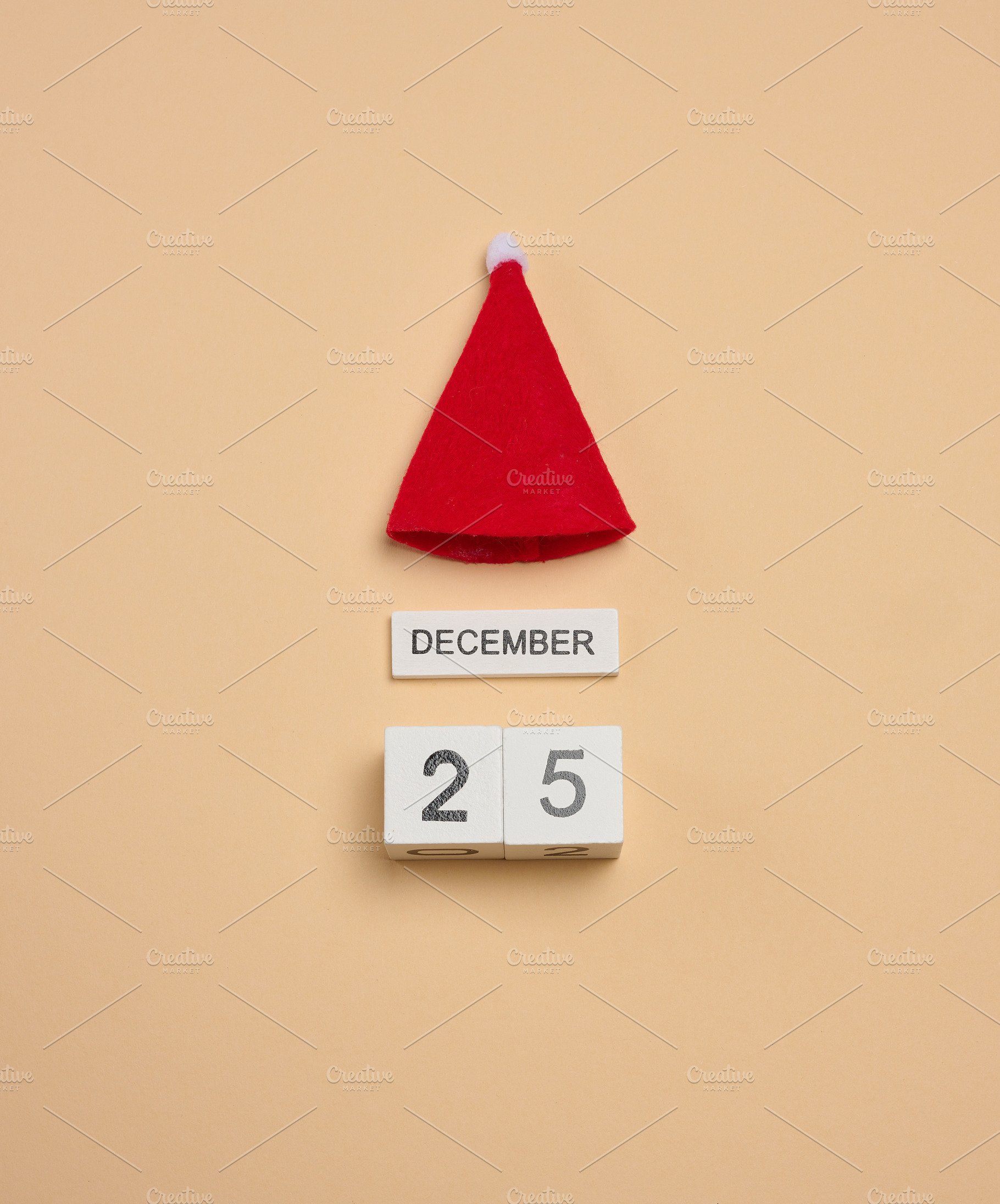 A wooden cube calendar with the date DECEMBER 25th and a red fel, a Holiday Photo by ndanko