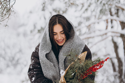 Happy woman holding winter bouquet, a Holiday Photo by Cherkas Photography