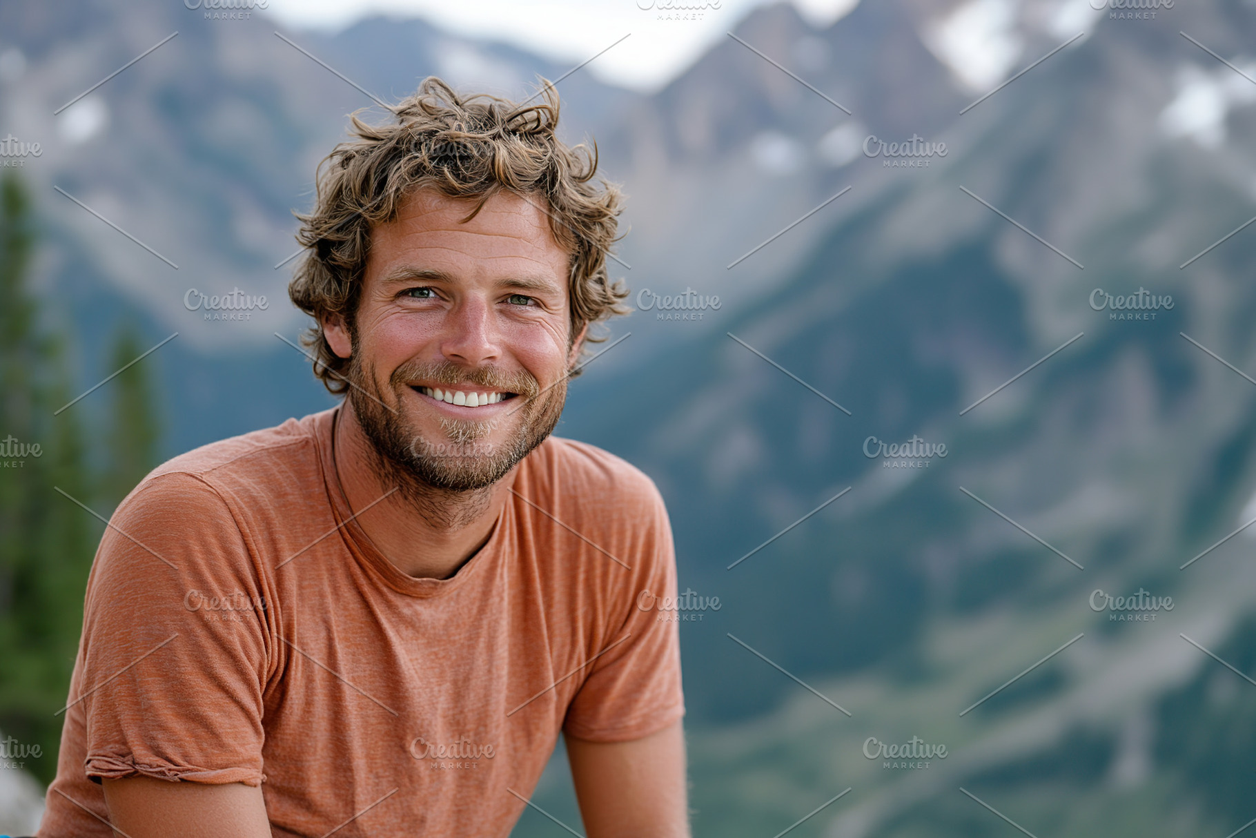 Smiling man enjoying the outdoors with mountains in the backgrou, a Person Photo by AlyaAnd