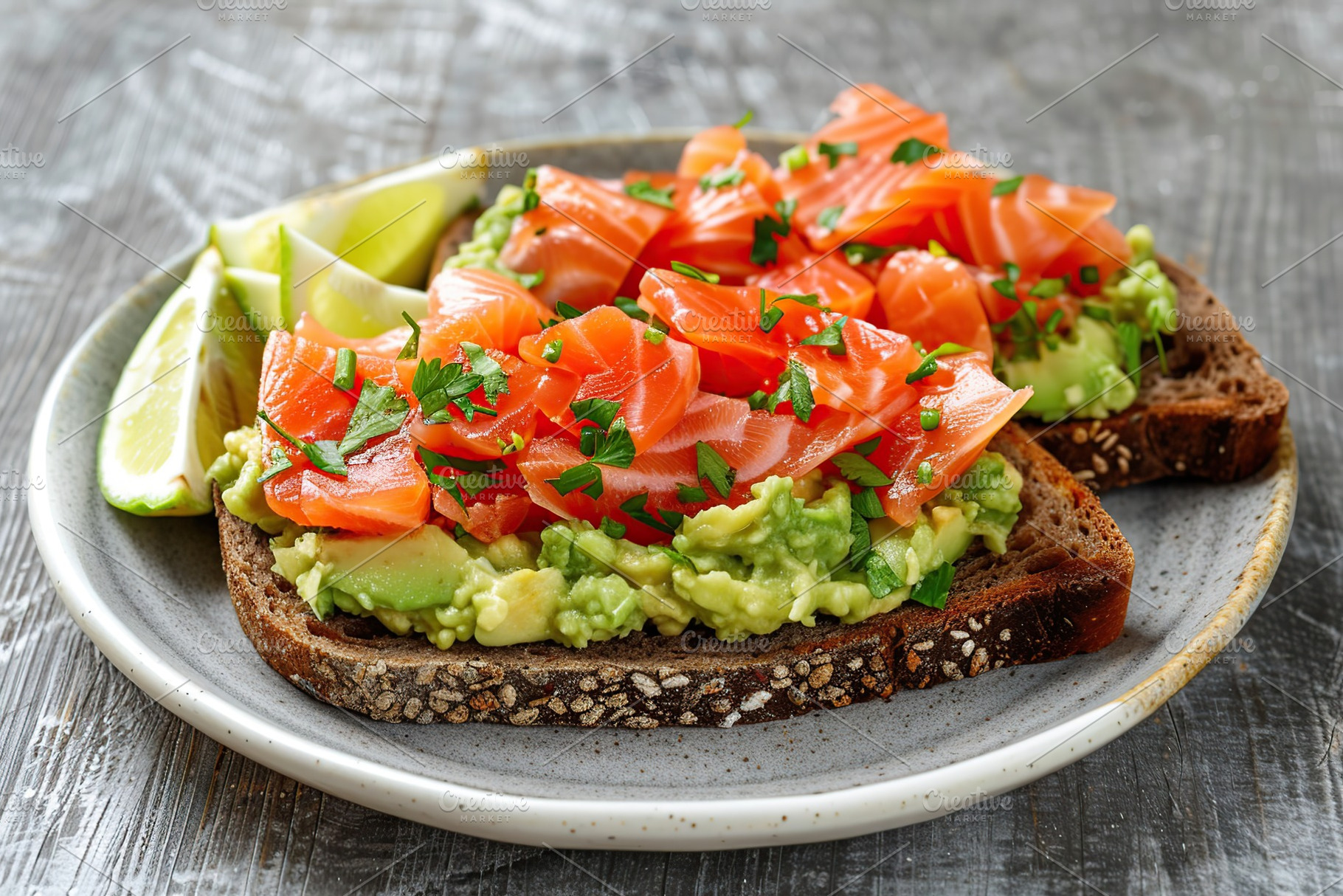 Toast bread with salted salmon and guacamole avocado in plate on wooden table, a Food & Drink Photo by AlyaAnd