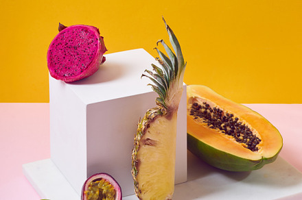 Tropical fruits variety on a colorful background. Side view with